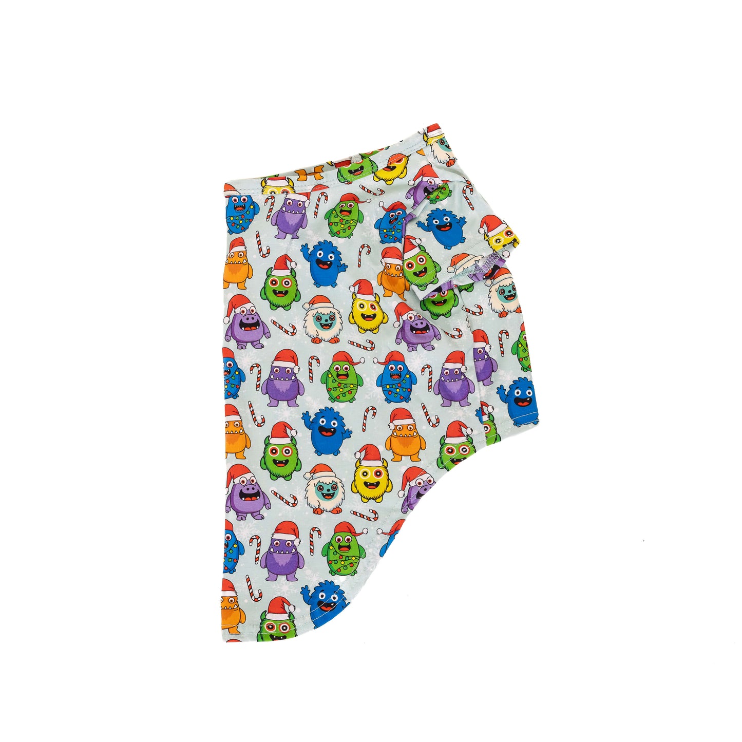 Side view flat lay of the Festive Monsters Christmas dog shirt showcasing the holiday monster print with Santa hats and candy canes.