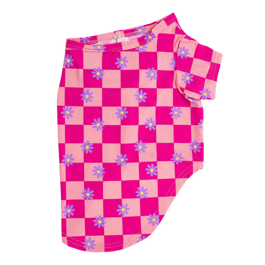 Side flat lay of Vibrant Hounds Crazy Daisy cooling shirt for dogs. It is pink chequered with daisys printed on it.